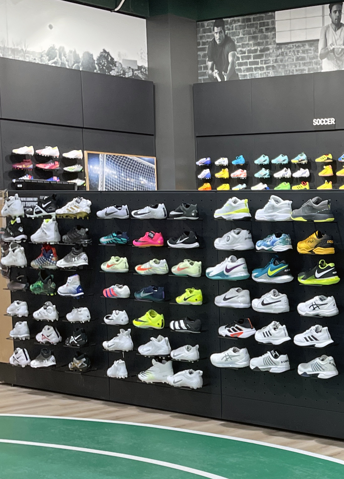 shoe store with walls of sneakers on display