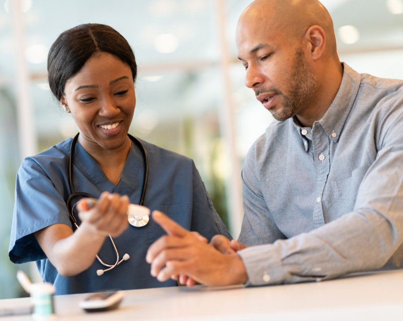 Black man at doctor office with black nurse getting a glucose screening